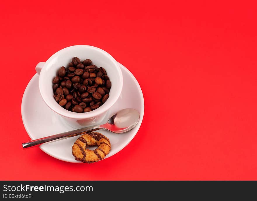 Macro studio shot of a cup of coffee beans.