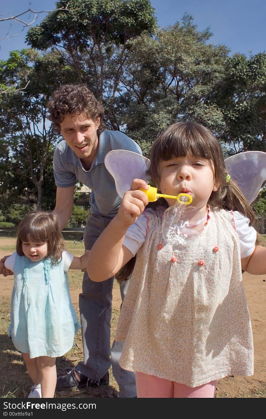 Young Girl Blowing Bubbles