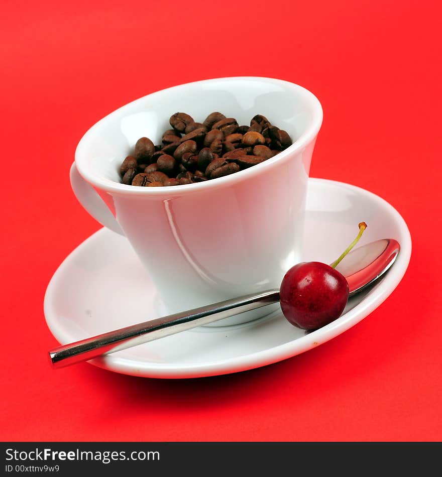 Macro studio shot of a cup of coffee beans.