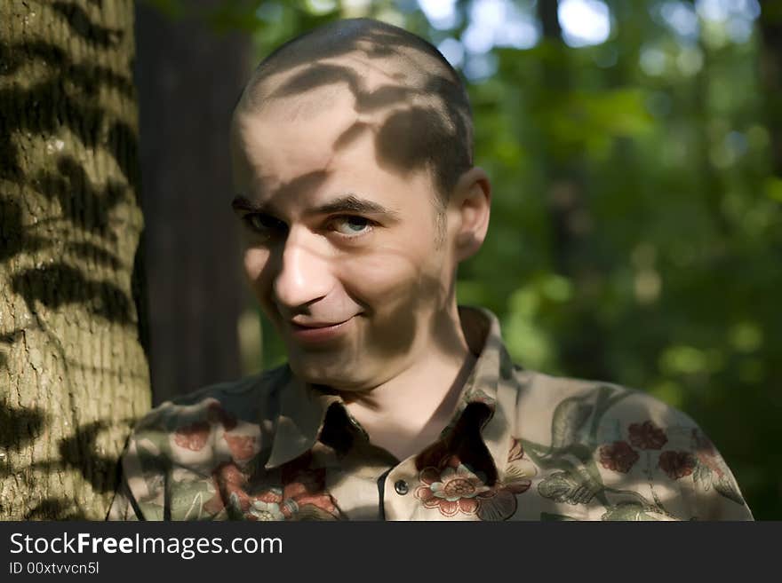 Young Man Near The Tree. Young Man Near The Tree