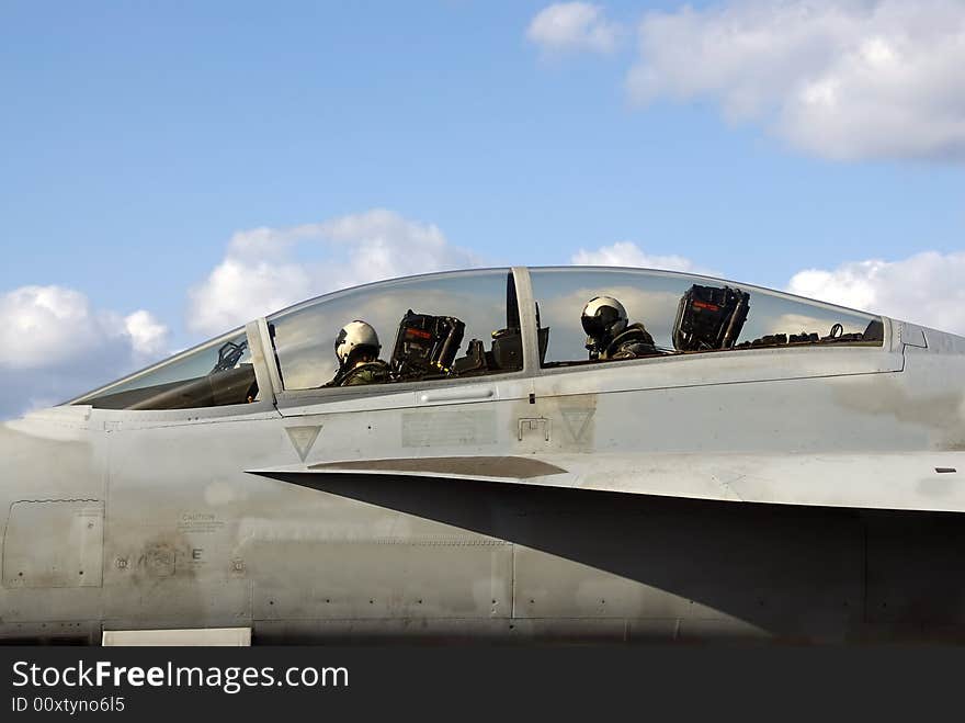 Two Naval aviators in the cockpit of their F-18 Super Hornet. Two Naval aviators in the cockpit of their F-18 Super Hornet