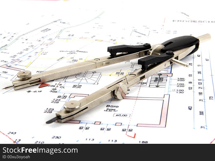 Building plan with pair of compasses and rolling meter for the architecture of a detached house