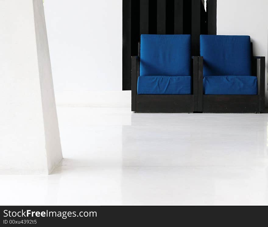 Two blue chairs in a modern interior.