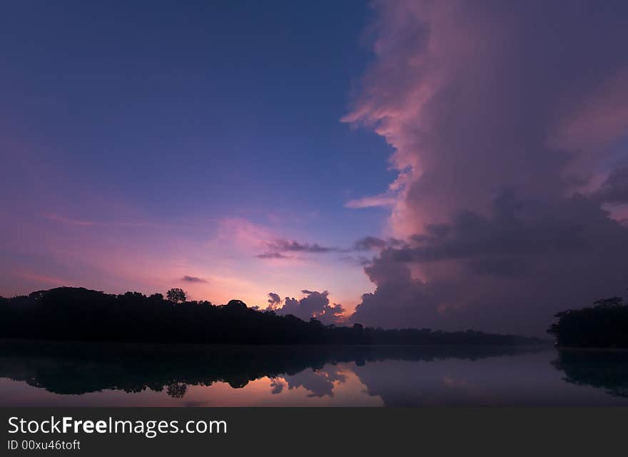 Twilight skies illuminated by the rising sun below the horizon. Twilight skies illuminated by the rising sun below the horizon