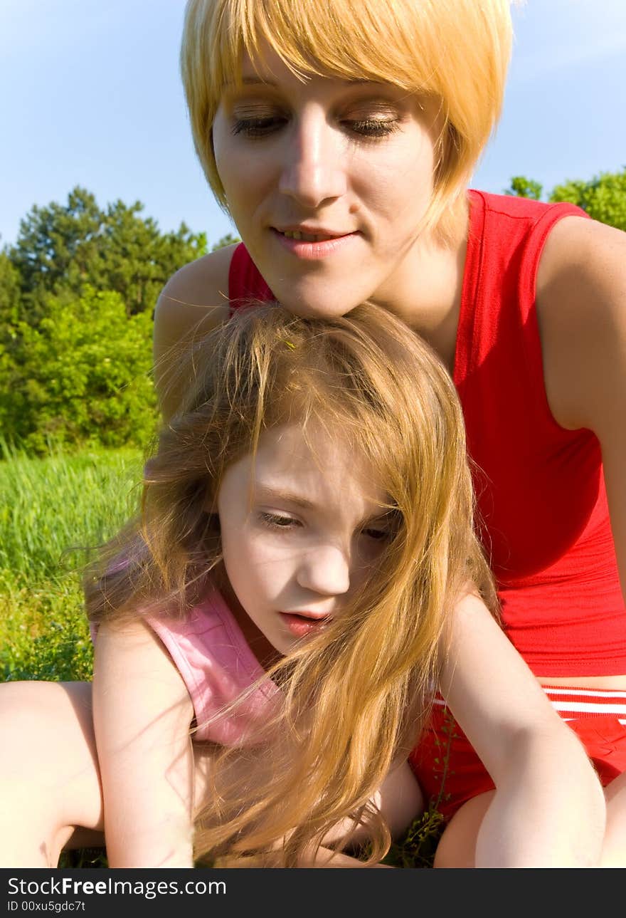 Mother and daughter having a good time together outdoors