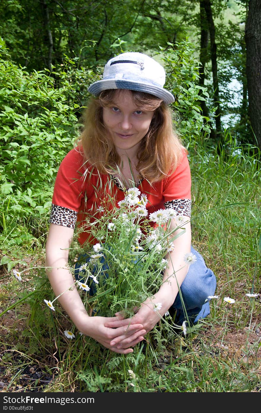 The young girl with camomiles