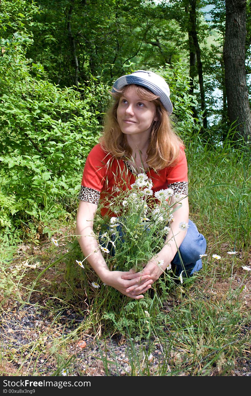 The young girl with camomiles