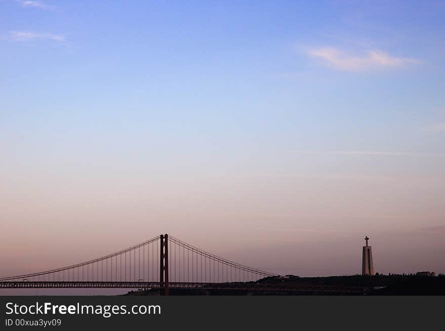 Detail of bridge and monument of Portugal at sunset. Detail of bridge and monument of Portugal at sunset