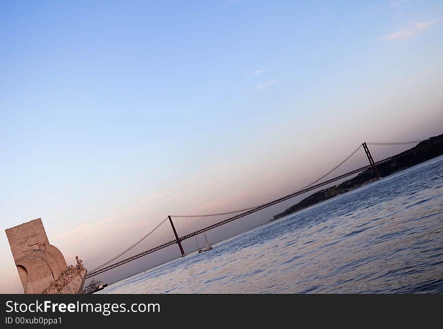 Bridge and monument of Portugal at sunset. Bridge and monument of Portugal at sunset