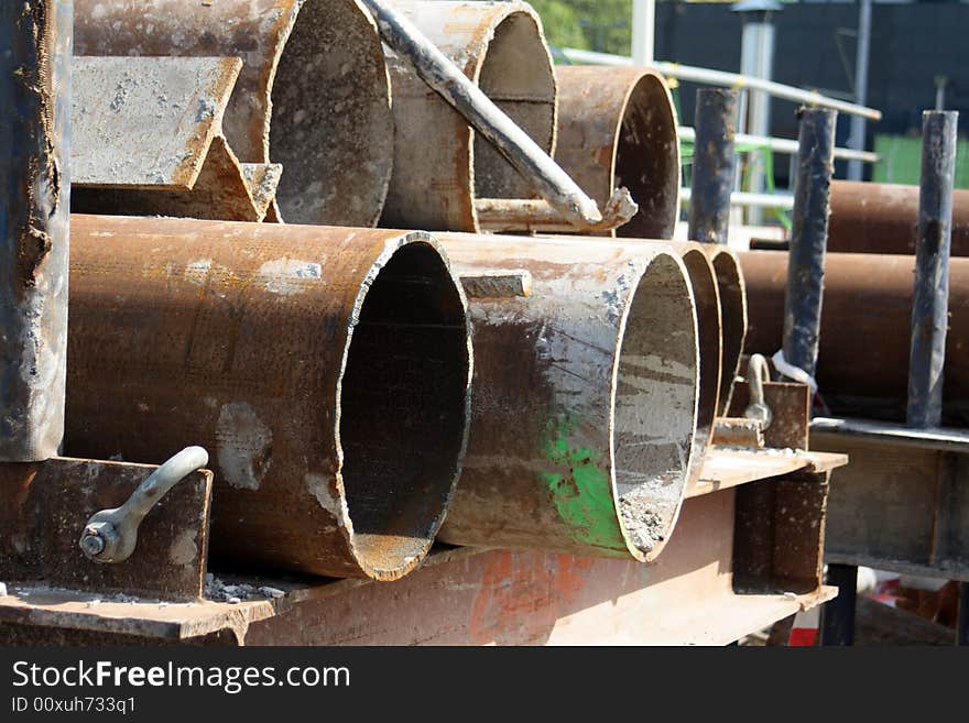 Rusty pipes on a construction site just waiting