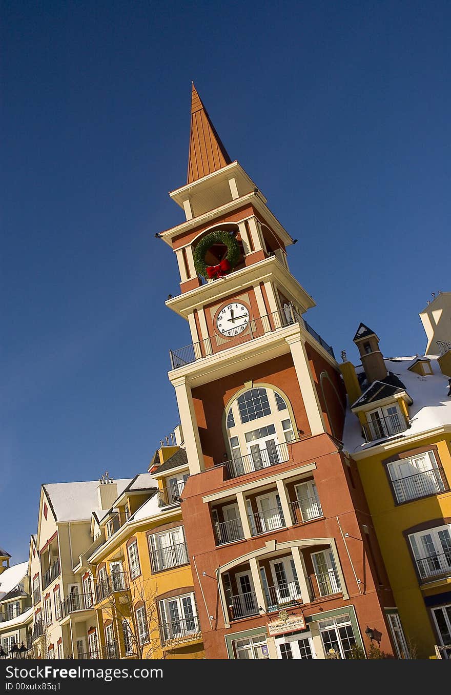 A clock tower by a beautifull sunny day