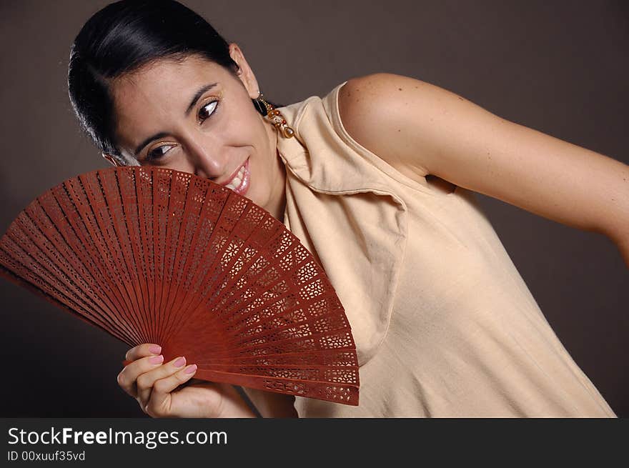 Hispanic woman with fan