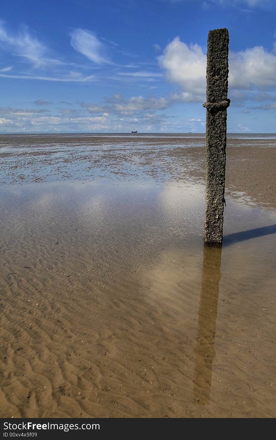 Historical tide measuring pole on the shore at Formby,Sefton-Coast,Meresyside. Historical tide measuring pole on the shore at Formby,Sefton-Coast,Meresyside