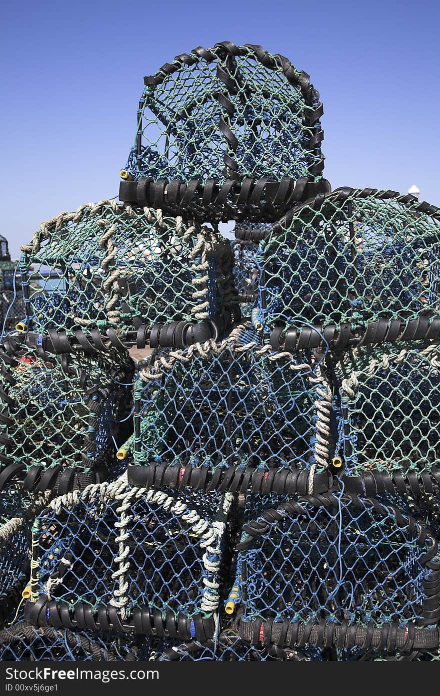 Lobster or crab baskets on the quayside ready for use. Lobster or crab baskets on the quayside ready for use