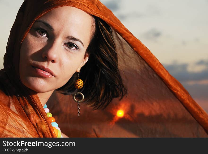 Portrait of beautiful hispanic woman in sunset background. Portrait of beautiful hispanic woman in sunset background