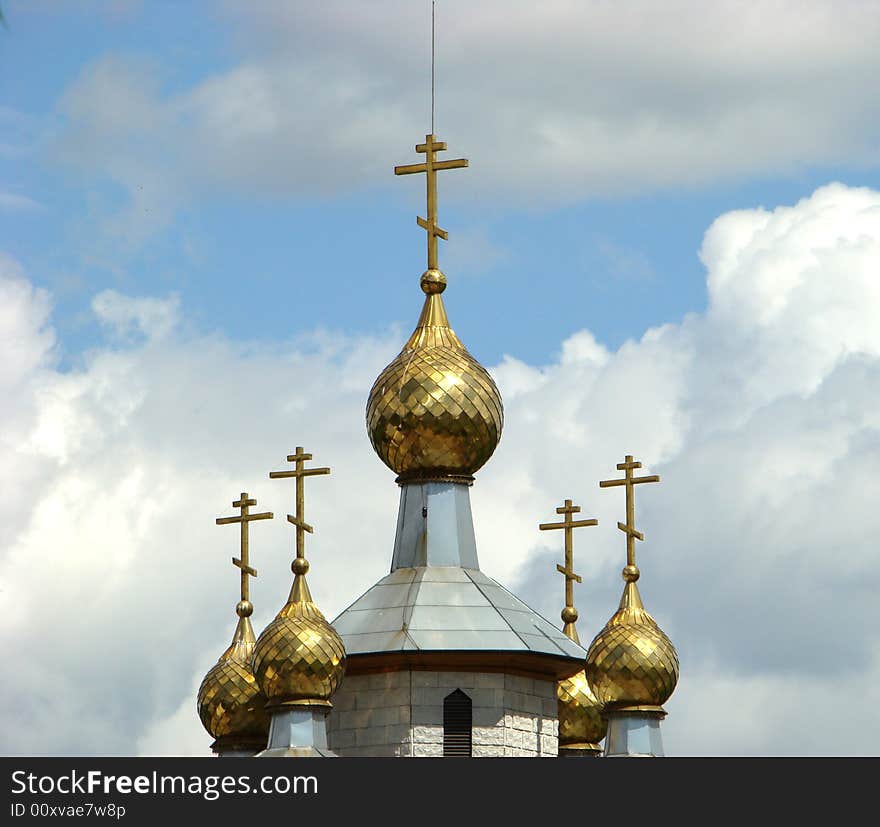 Gold domes of a temple of Andrey Pervozvannogo in Ljublino in Moscow