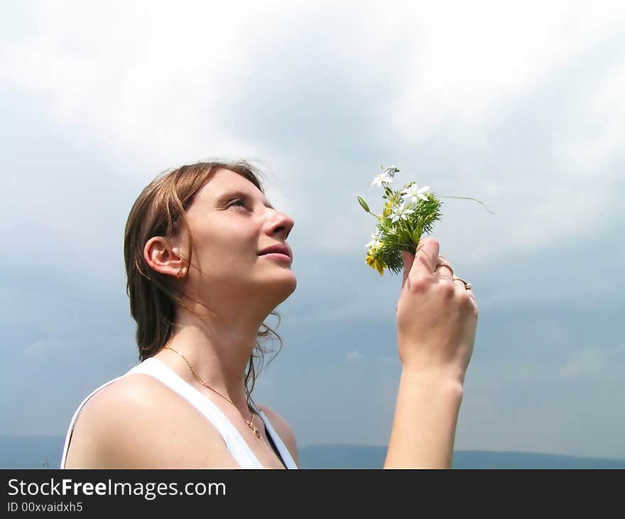 Girl Smelling Wild Flowers