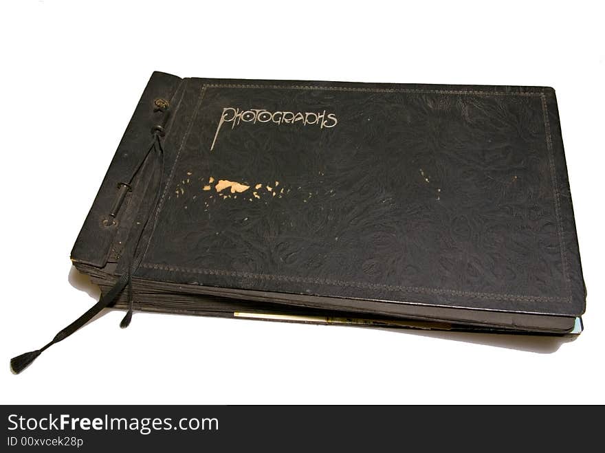 A very old family photo album, worn and used. A very old family photo album, worn and used.