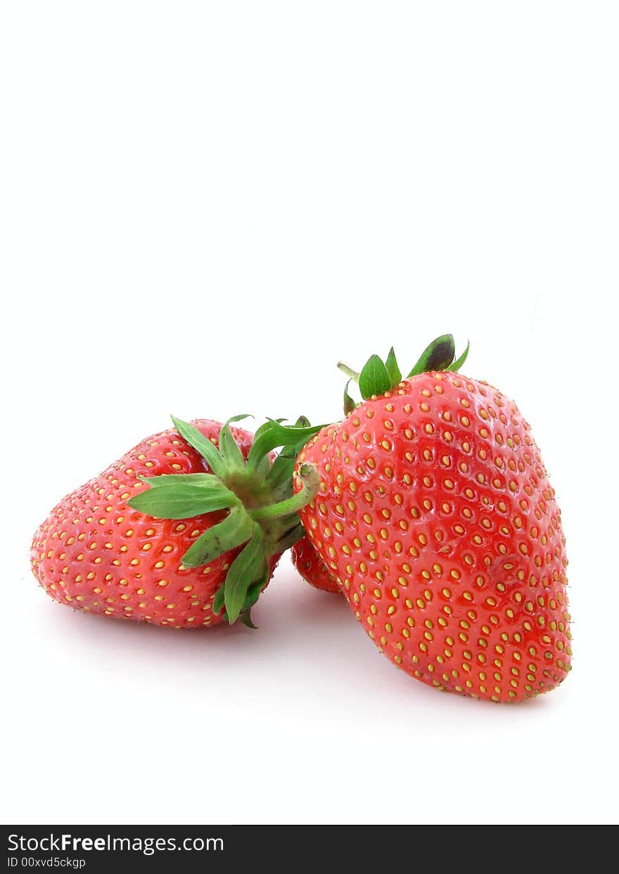 Juicy strawberries isolated over white background, concept of healthy organic, homegrown food and diet.