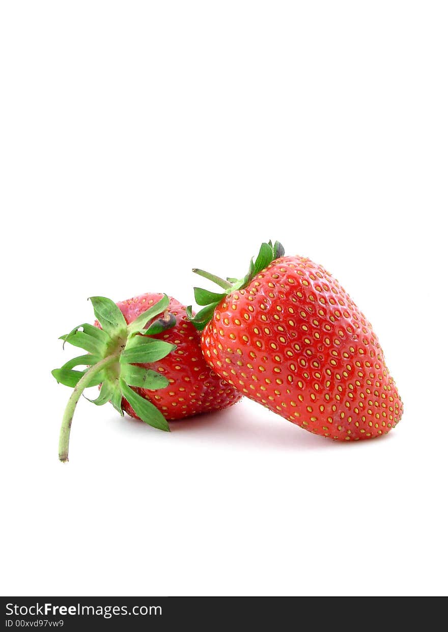 Juicy strawberries isolated over white background, concept of healthy organic, homegrown food and diet.