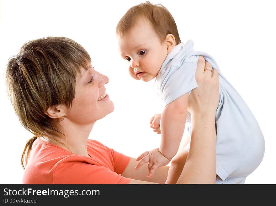 Young mother hold his baby in hands and smile to him. Young mother hold his baby in hands and smile to him