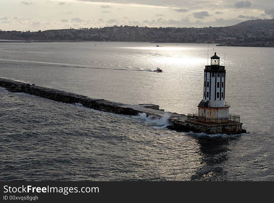 An old lighthouse keeps watch over the entrance to the port. An old lighthouse keeps watch over the entrance to the port.