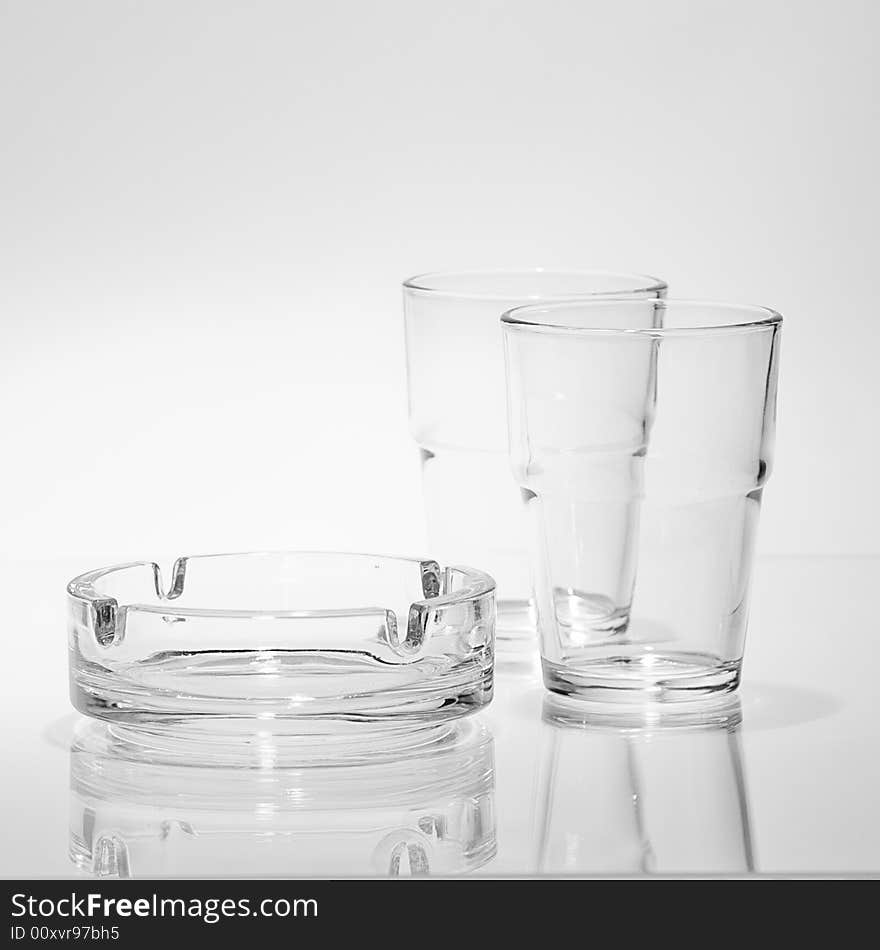 Two beakers, and ashtray on the glass footprint