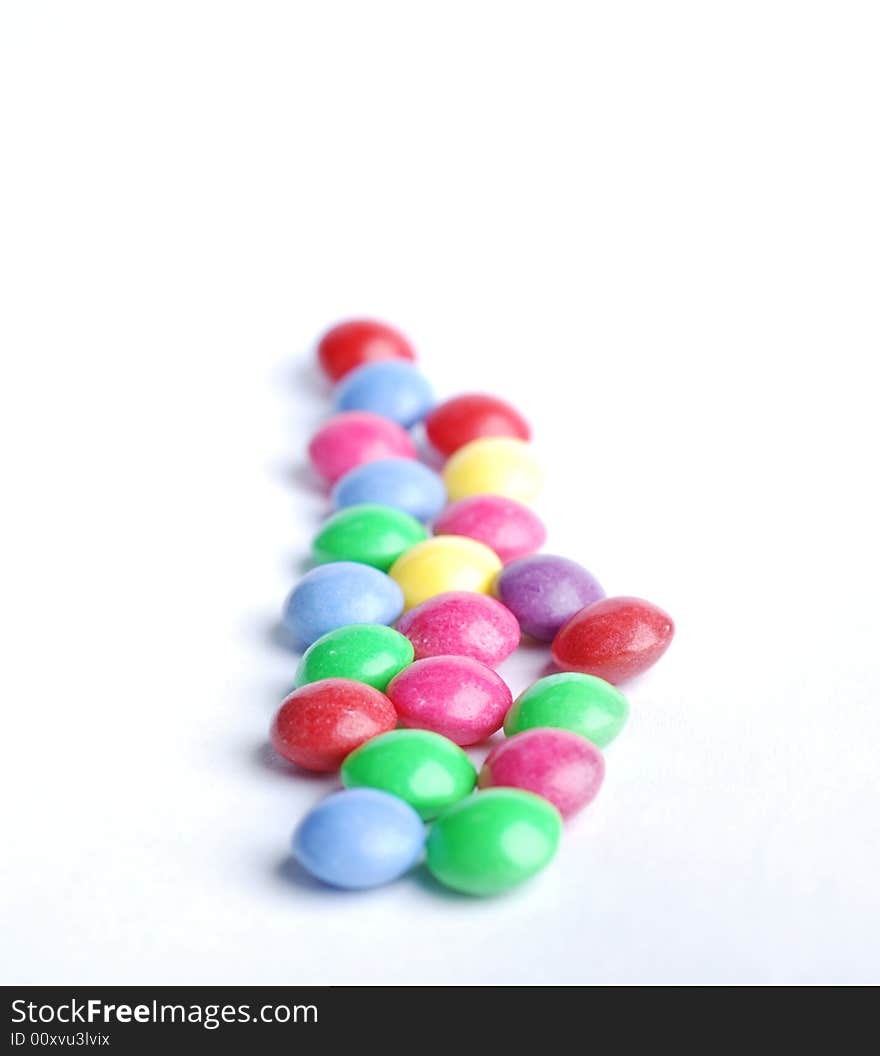 Sweet candy with different colours at white background. Sweet candy with different colours at white background