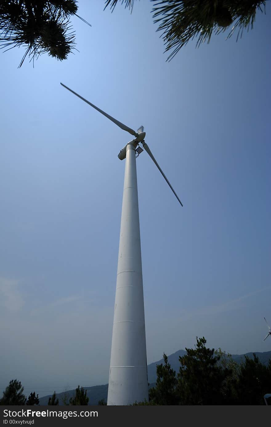 A wind turbine in the mountain.