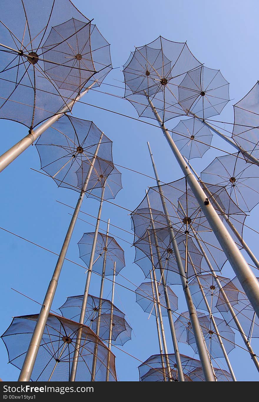 View on umbrellas against a blue sky