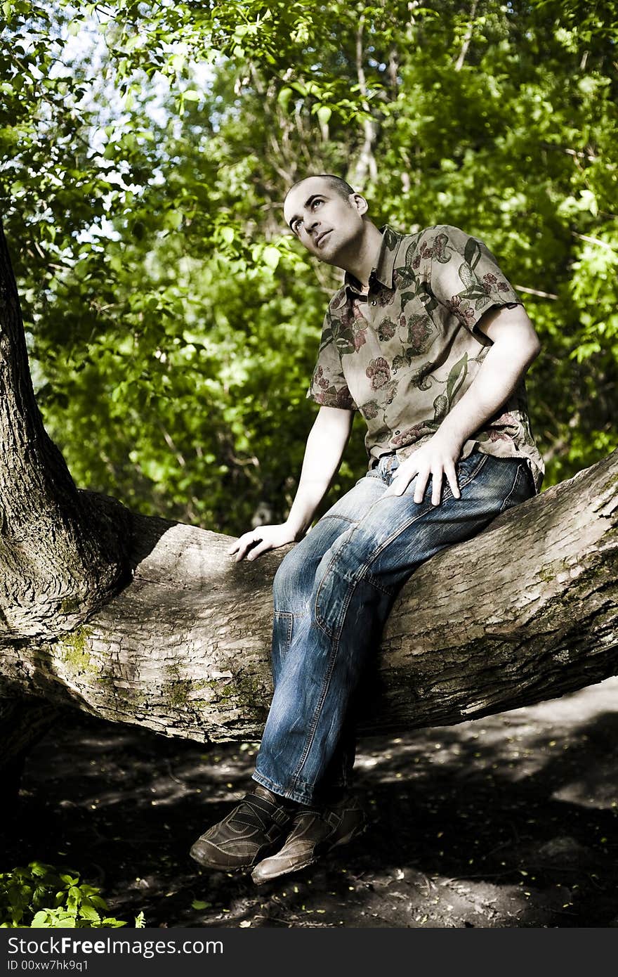 Under The Sunlight. Young Man Enjoying The Summer Time