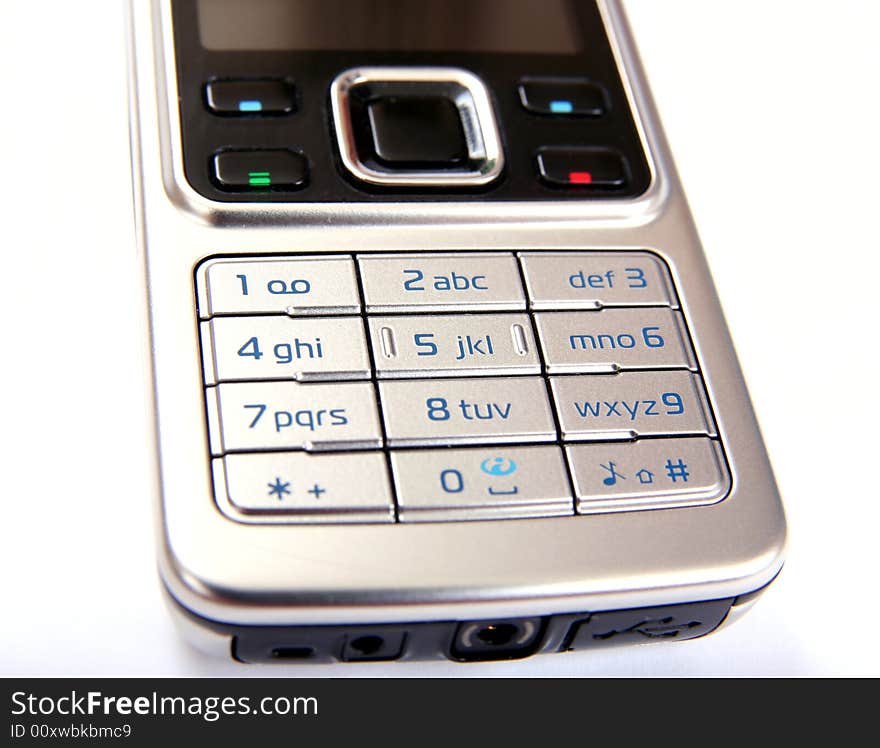 Modern silver mobile phone close-up isolated