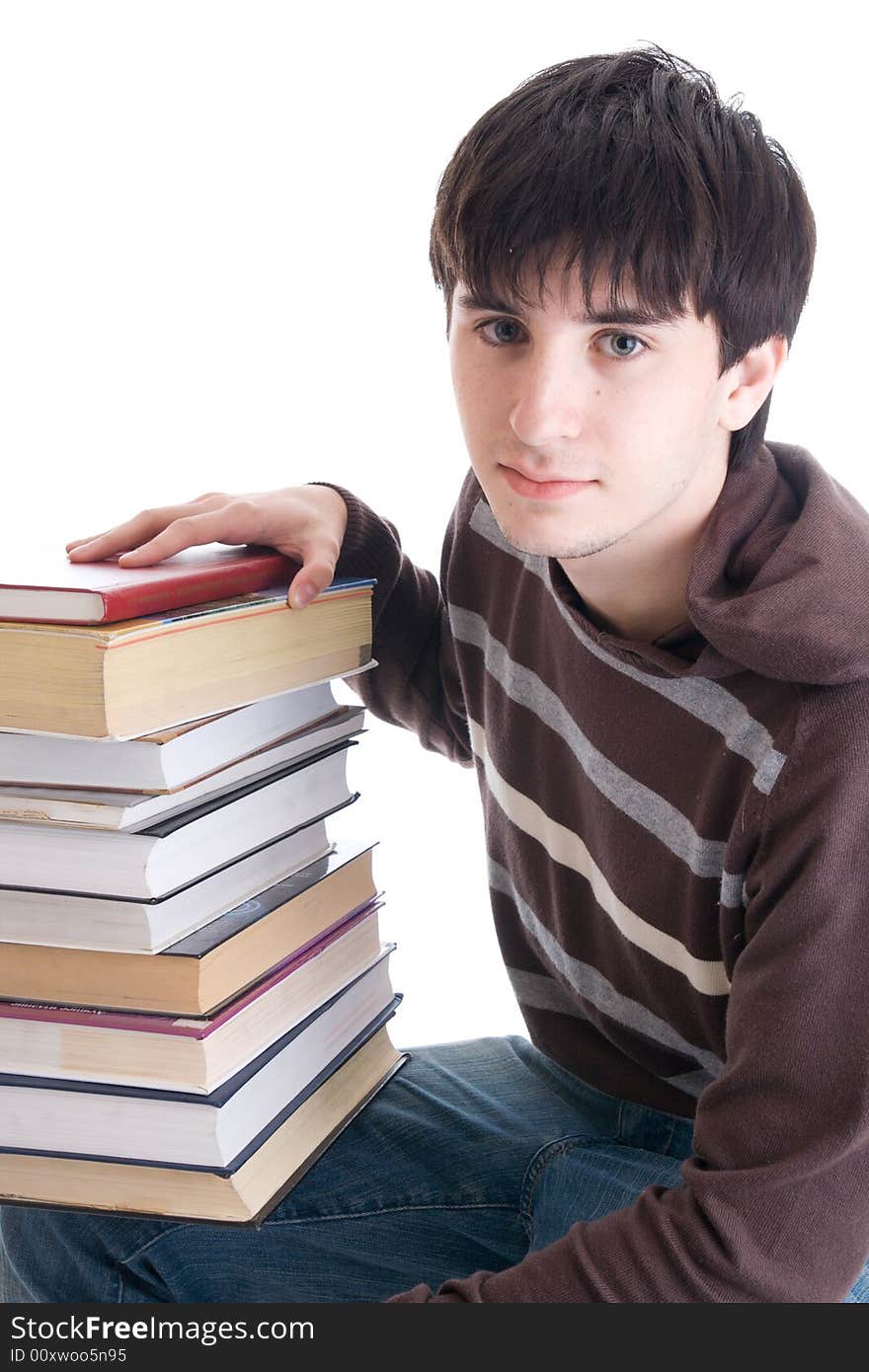 The young student with the books isolated on a white background