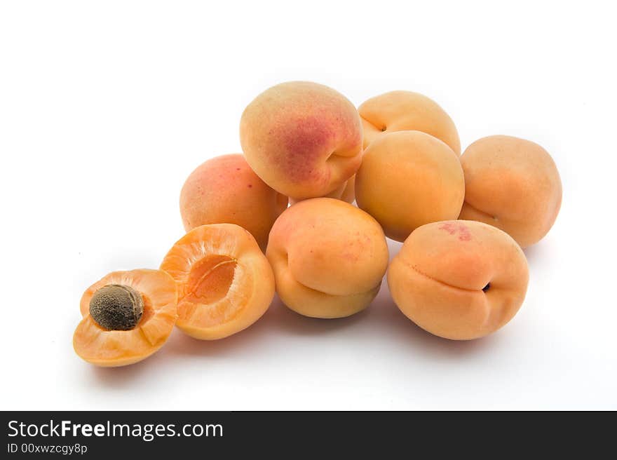 Group of apricots with on open isolated on white