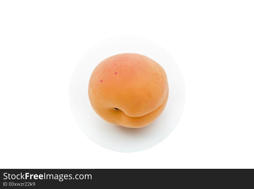 Single apricot isolated on white