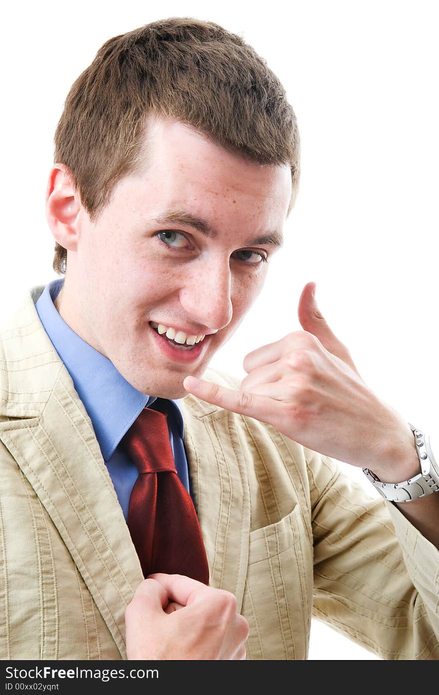 The young beautiful man speaks and smile. Sign: I call you. Isolated on white background