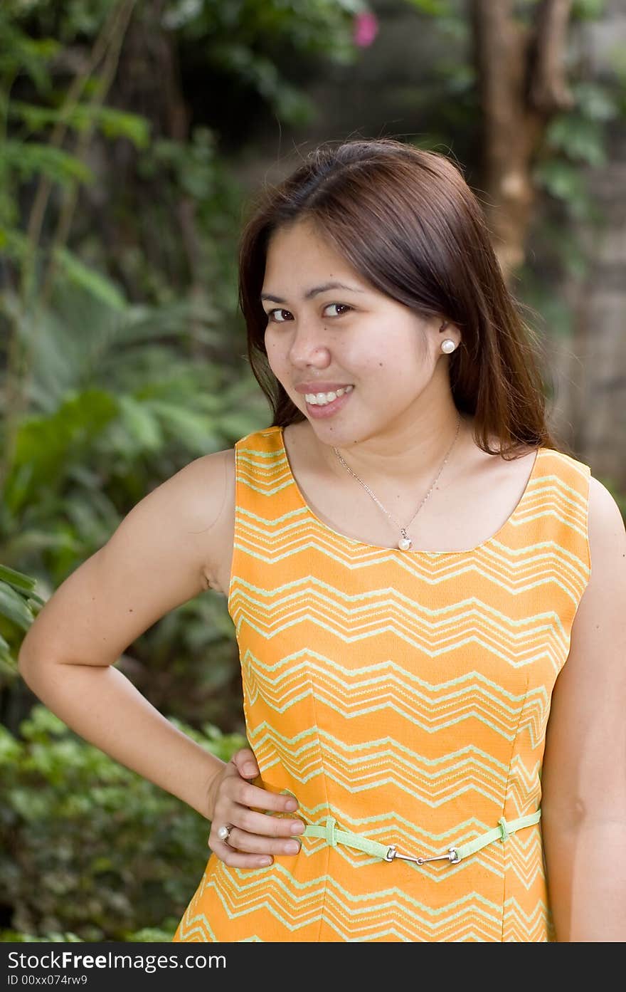 A portrait of a beautiful asian lady with pearls posing for the camera. A portrait of a beautiful asian lady with pearls posing for the camera