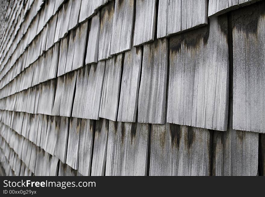 Rows of Weathered Wood Shingles with Moss