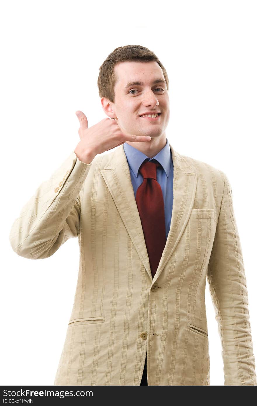 The young beautiful man speaks and smile. Sign: call me. Isolated on white background