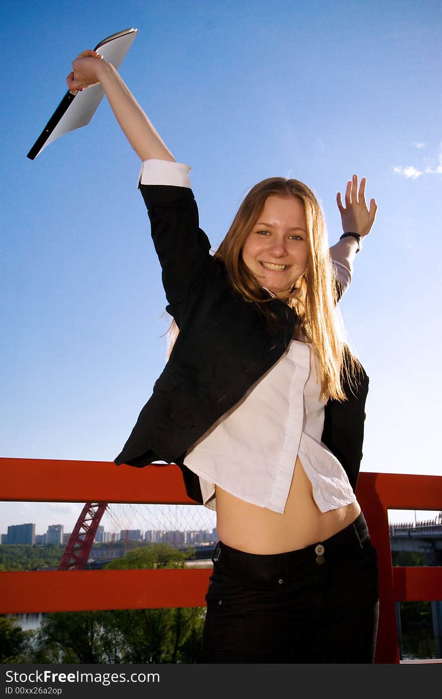 The Young Businesswoman With A Folder