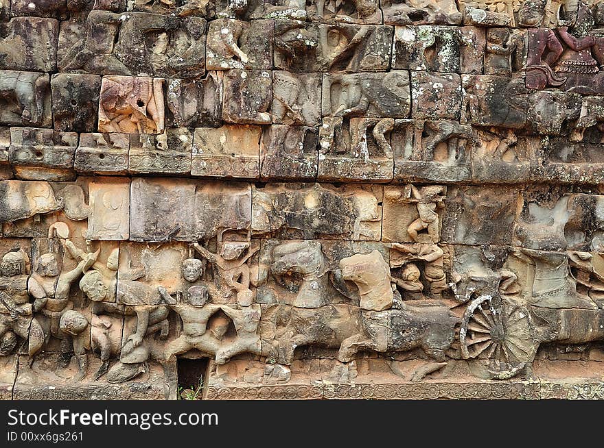 The leper king terrace constructed during the reigns of Jayavarman VII and Jayavarman VIII (12th-13th centuries) overlooking the royal square is supported by 300 meters of walls of foundation; these walls are carved with mythological figures. The leper king terrace constructed during the reigns of Jayavarman VII and Jayavarman VIII (12th-13th centuries) overlooking the royal square is supported by 300 meters of walls of foundation; these walls are carved with mythological figures