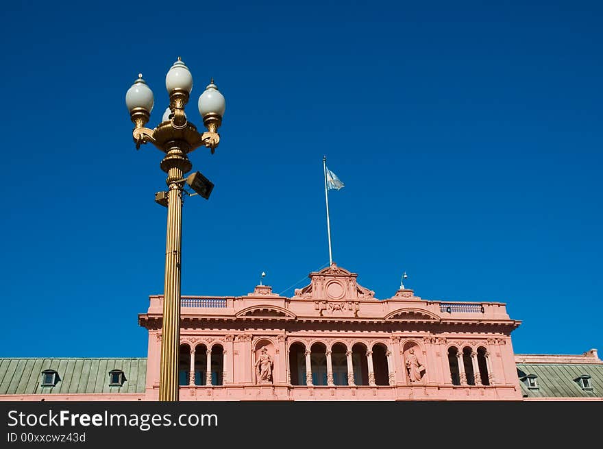 Pink house, official house of the president of Argentina, with a streetlight. Pink house, official house of the president of Argentina, with a streetlight