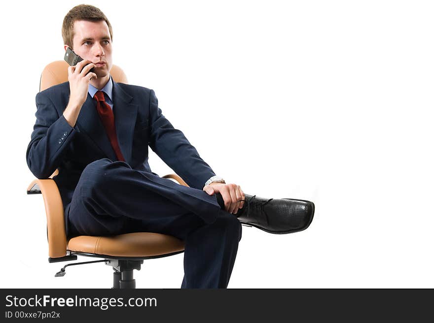 Businessman sitting on an armchair