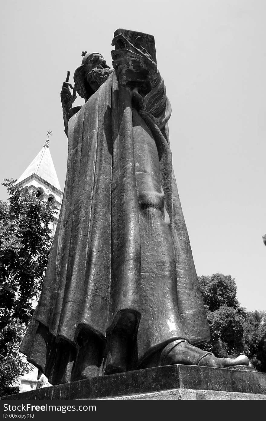 A scholastic priest in bronze in Croatia. A scholastic priest in bronze in Croatia