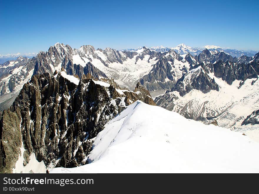 The snowy alps as seen from a high vantage point. The snowy alps as seen from a high vantage point