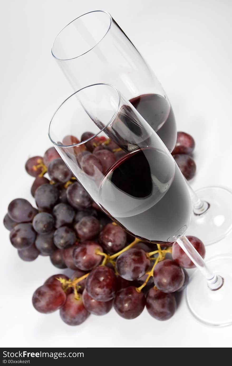 Glasses of red wine with grapes. Glasses of red wine with grapes