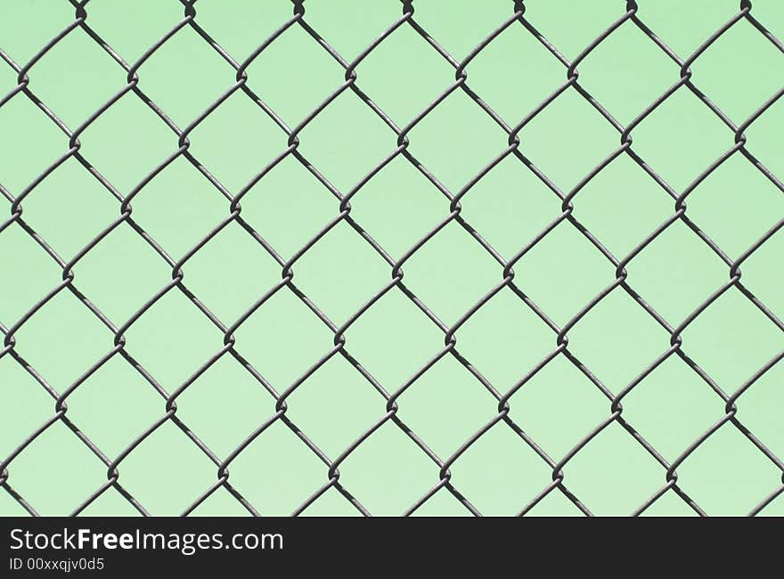 Chain link fence design on a green background. Chain link fence design on a green background