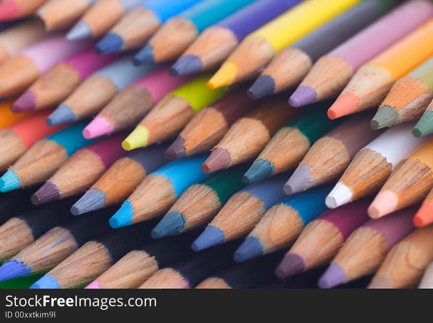 Stack of colored pencils shllow depth of field.