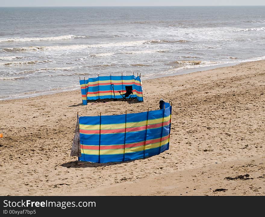 Two windbreaks on a beach