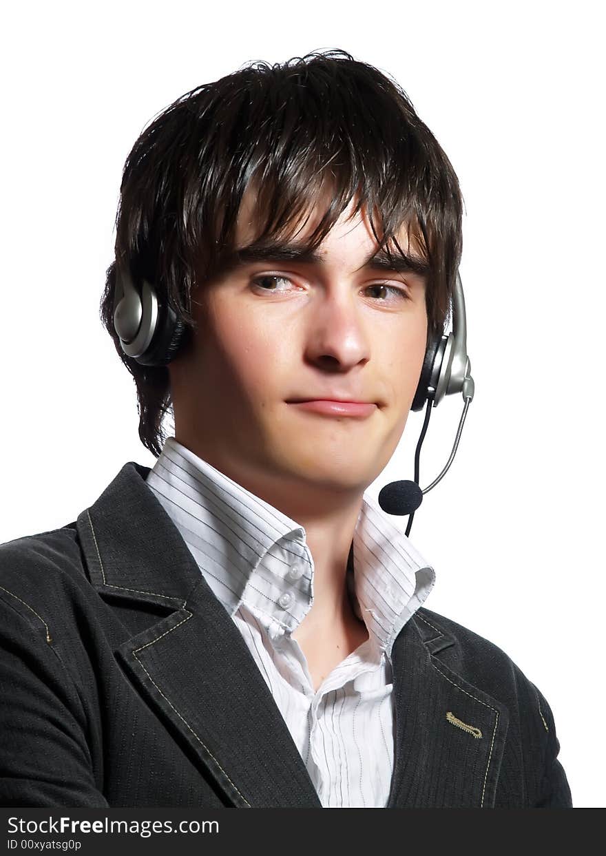 A portrait about a handsome helpdesk operator man who is smiling and he has a headphone. He is wearing a white shirt and a stylish black suit. A portrait about a handsome helpdesk operator man who is smiling and he has a headphone. He is wearing a white shirt and a stylish black suit.